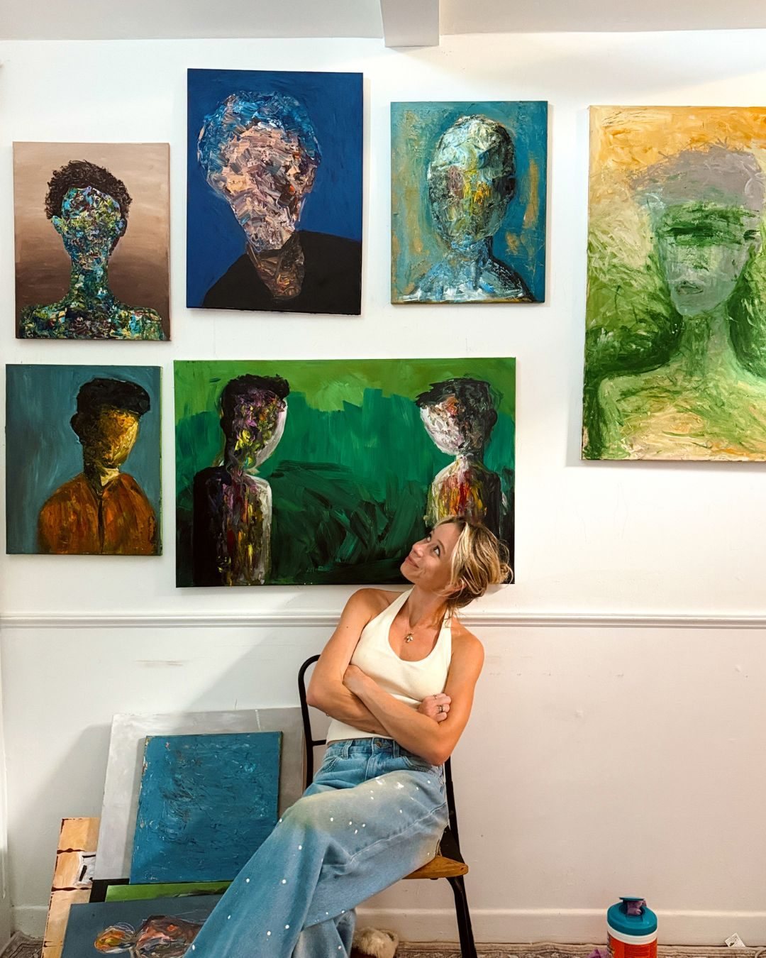 Stevie Alger in her Los Angeles studio with her faceless portraits
