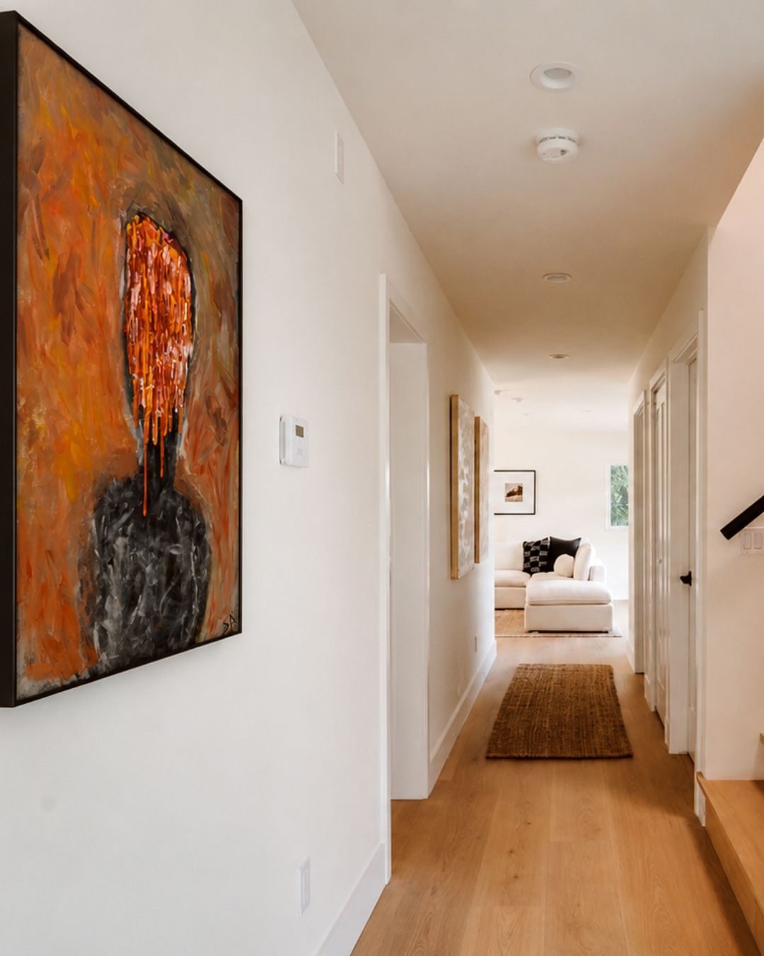 Original faceless portrait in a Los Angeles hallway