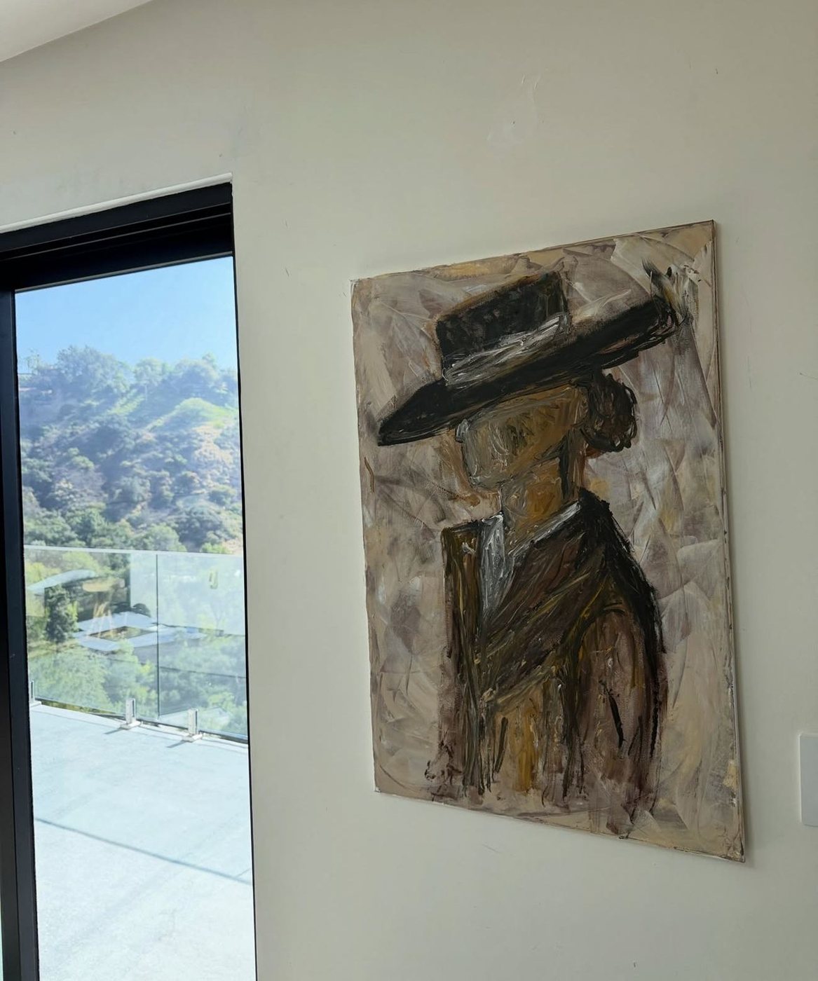 Faceless figure in a Hollywood Hills residence